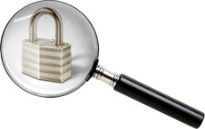 Image of magnifying glass viewing a locked padlock